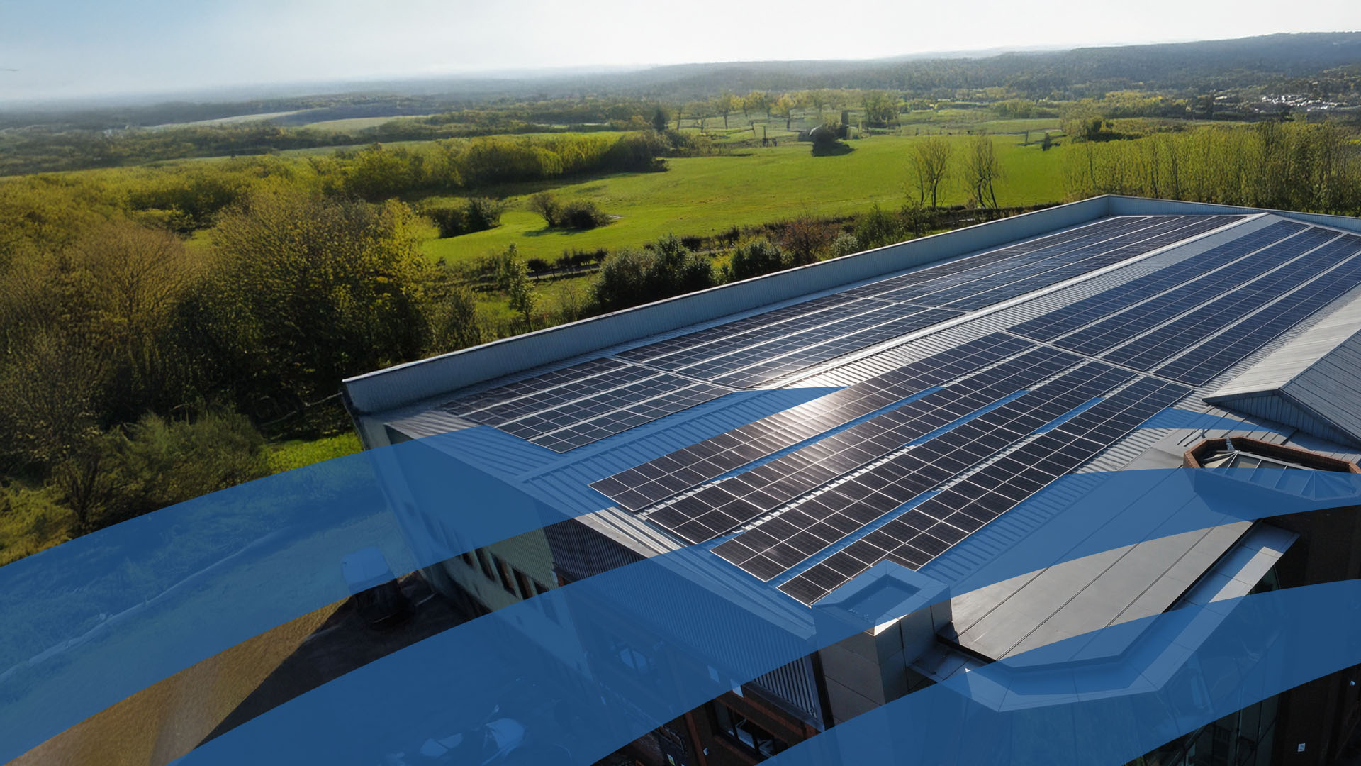 huge warehouse with lots of solar panels on the roof