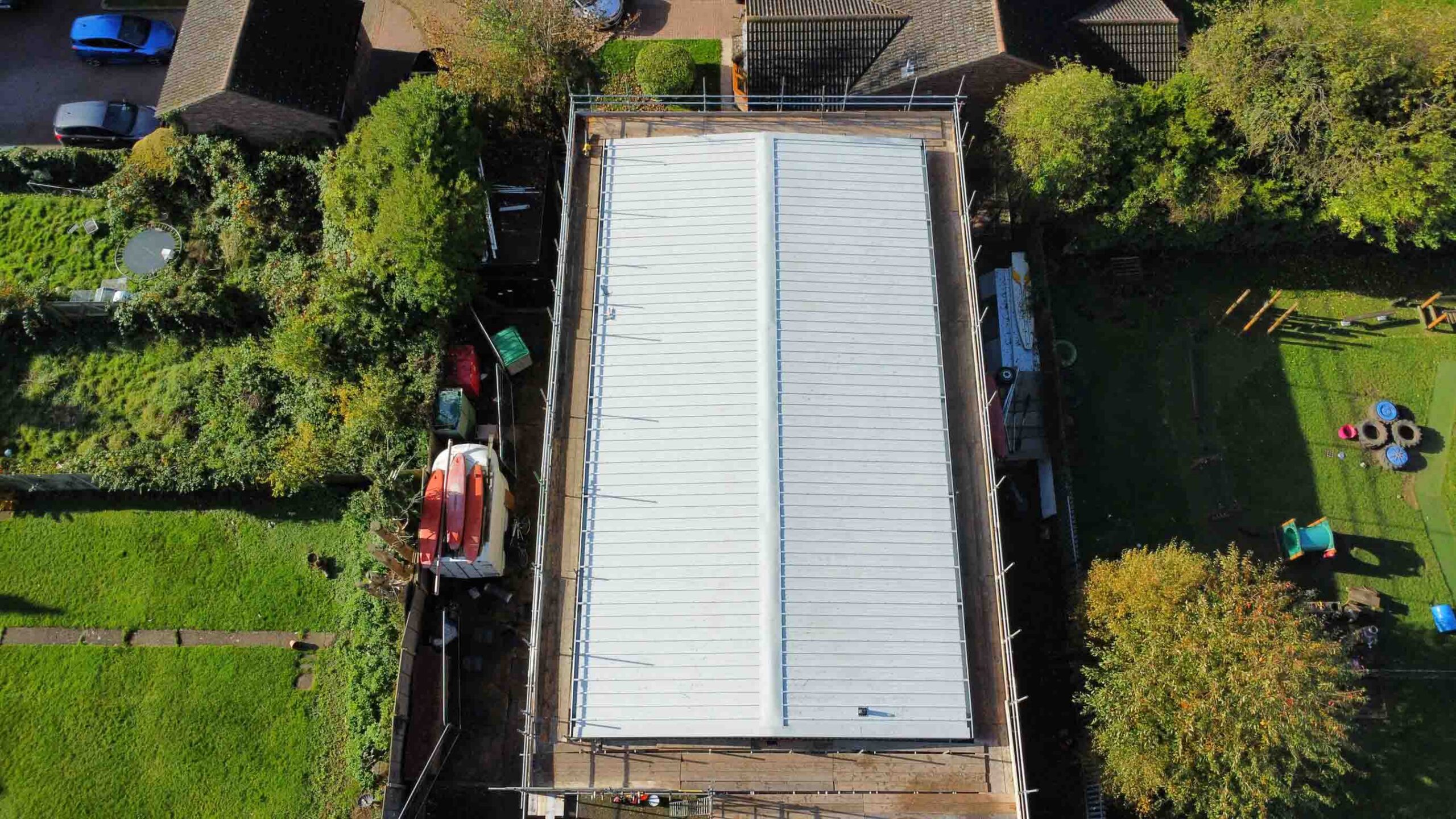 aerial photo of roof of scout hut being replaced, scaffolding visible