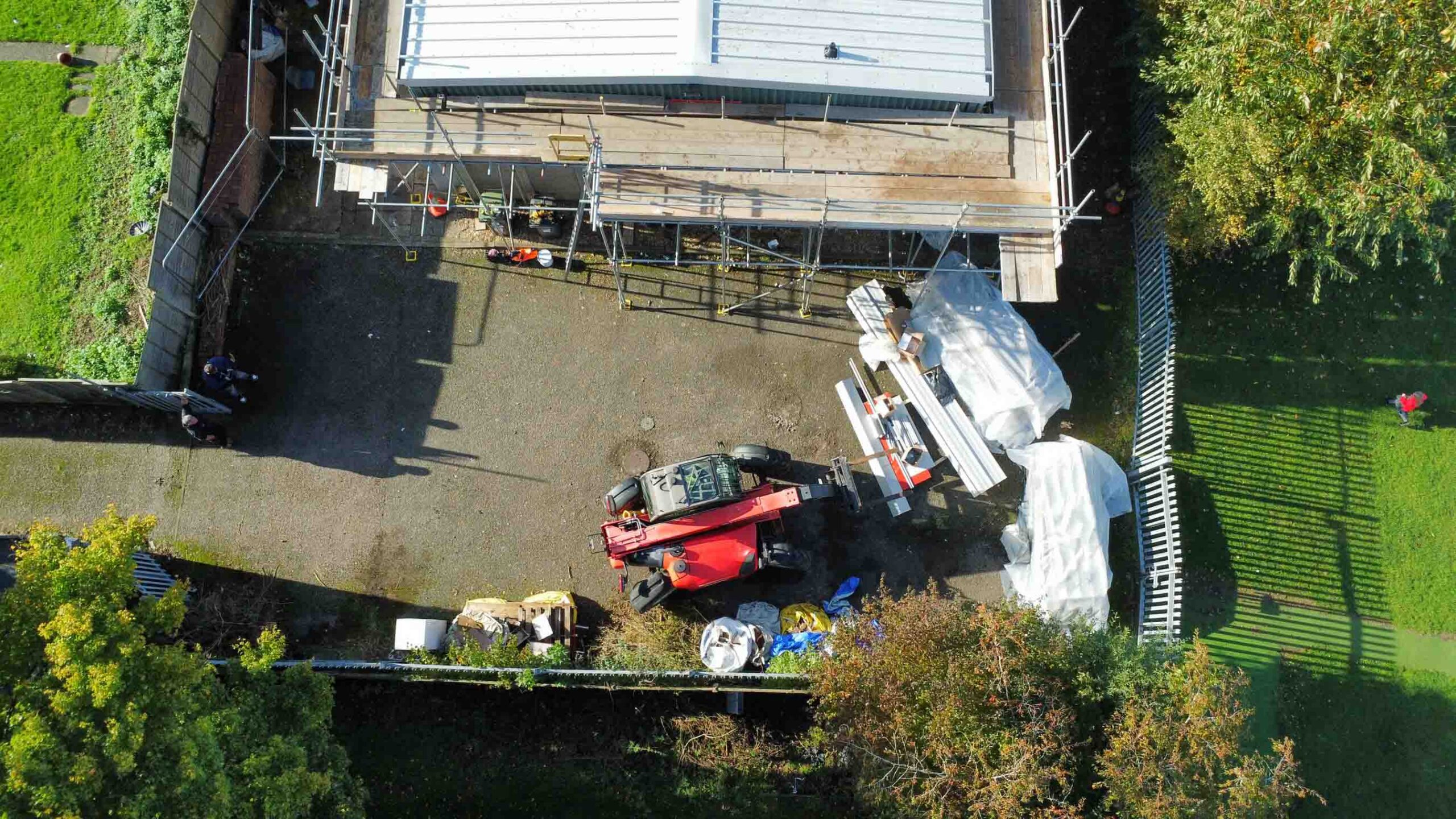 aerial view of fork lift working on site for roof of scout hut being replaced, scaffolding visible