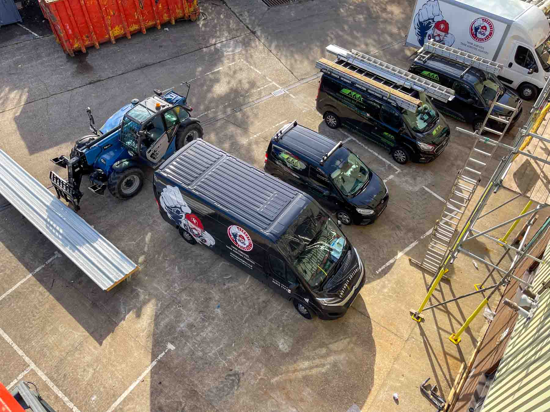 vans parked during roof installation in elstree, hertfordshire