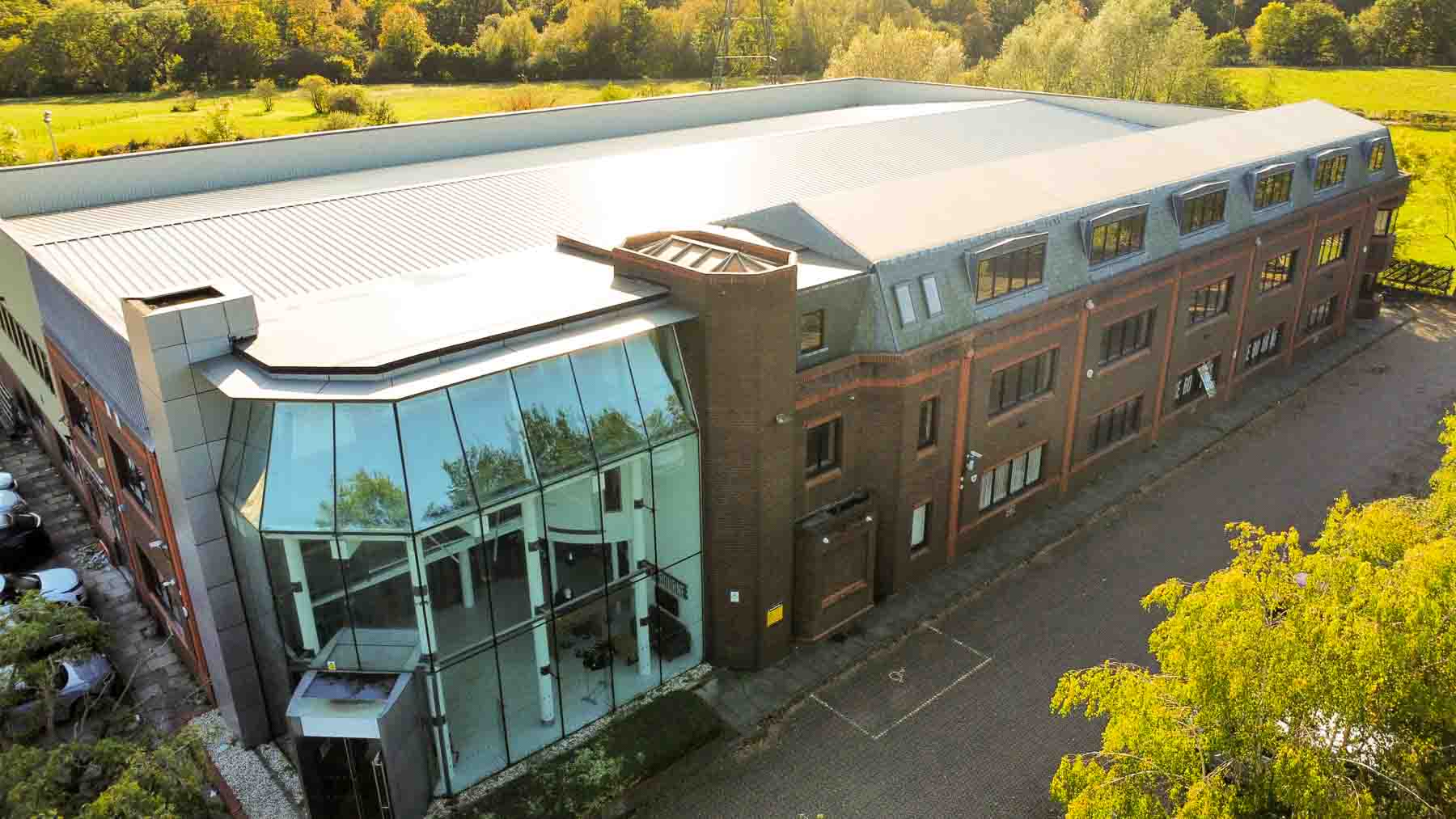 high angle shot of warehouse building during roof installation in elstree, hertfordshire