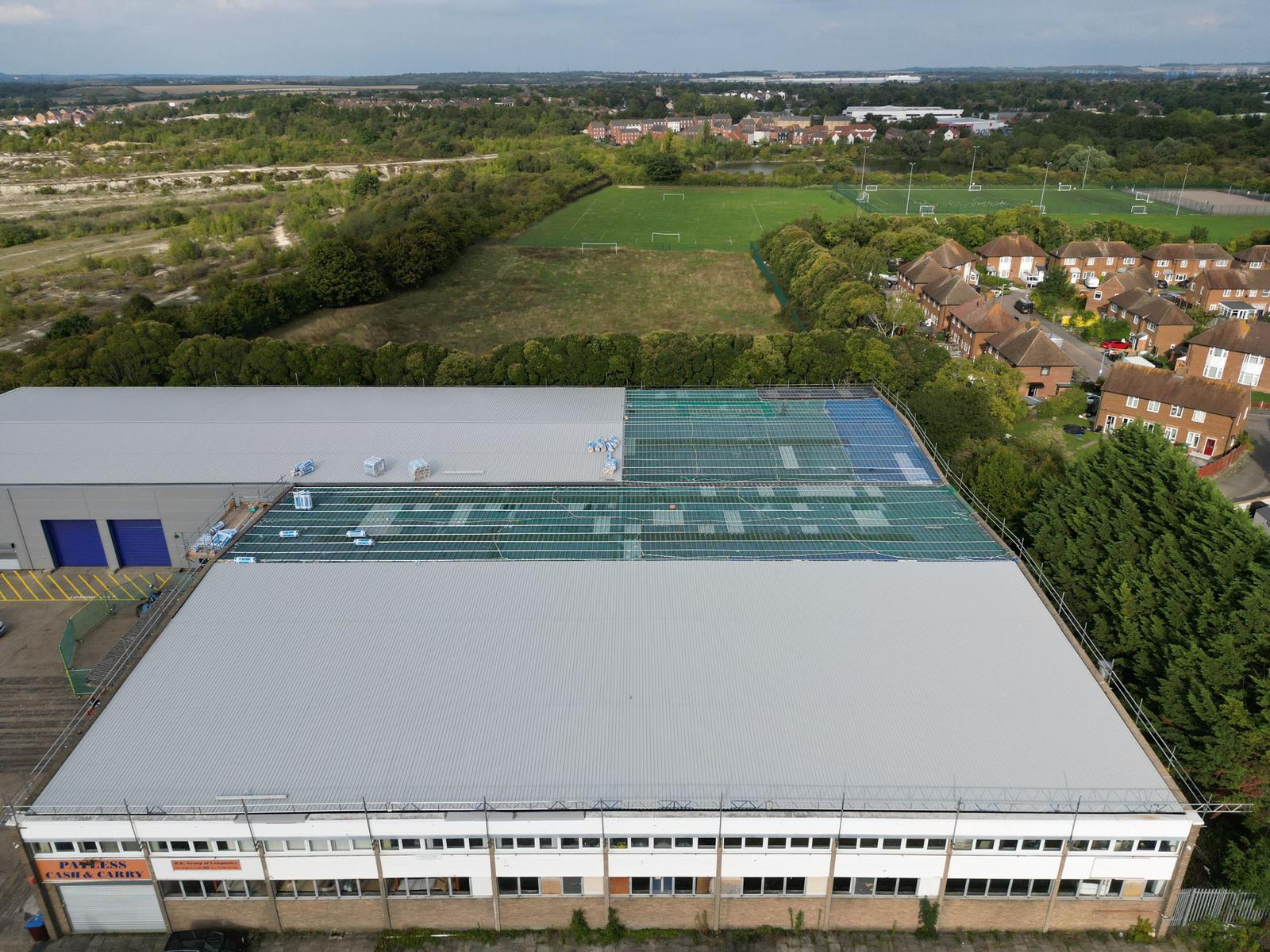 Aerial photo of warehouse with section removed for underlay to be added