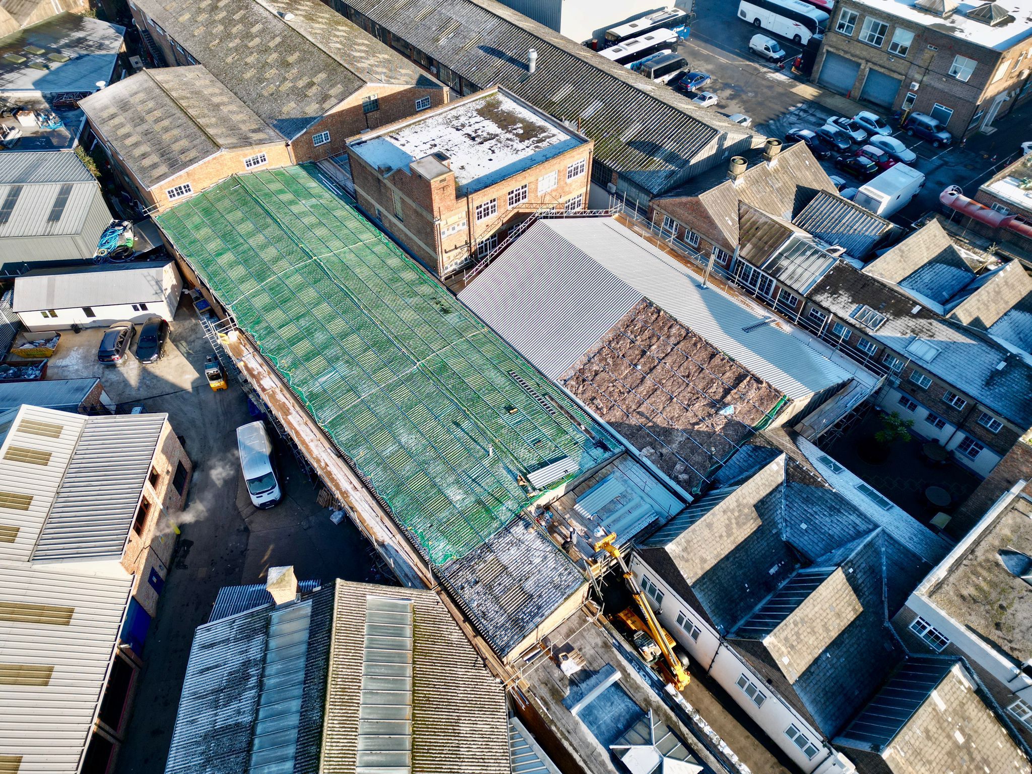 aerial image of of large warehouse roofing being upgraded