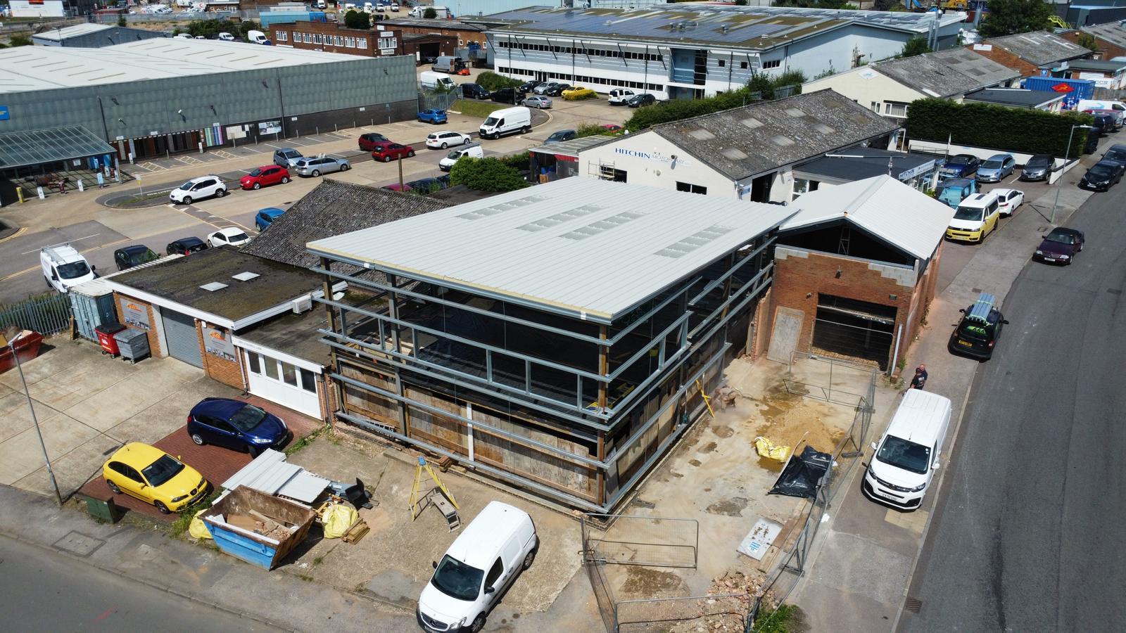 aerial image of of large building in the process of being build